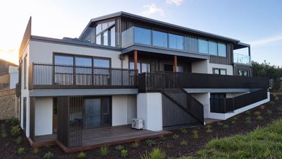 Postless architectural aluminium balustrade on a deck, Whangamata