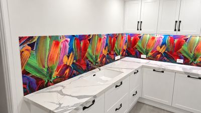 Printed glass splashback with a protea flower design in a kitchen